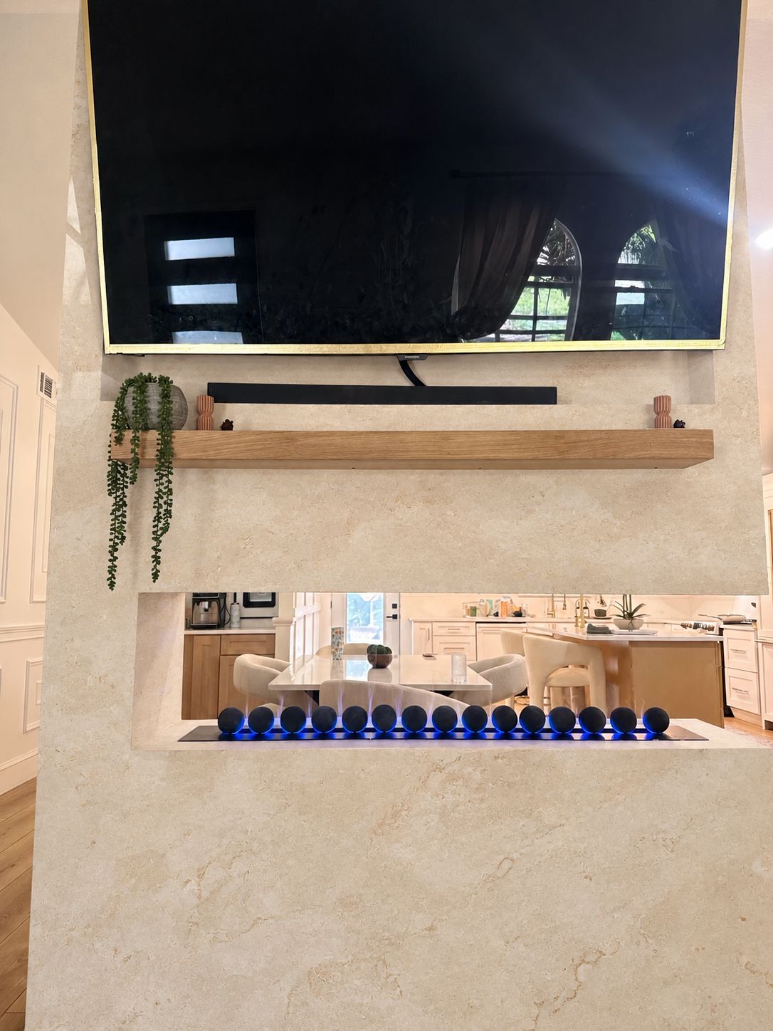 See-through vapor fireplace: Limestone finish, an AI-edited design concept based on this project